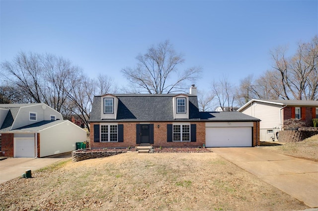 dutch colonial with roof with shingles, driveway, a chimney, a garage, and brick siding