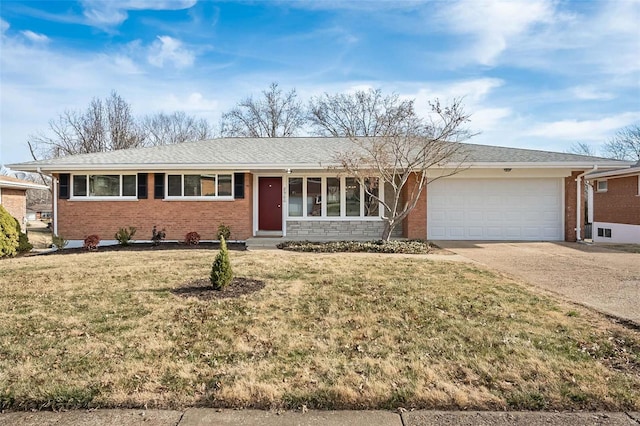 ranch-style house with brick siding, an attached garage, concrete driveway, and a front yard