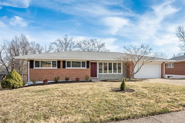 ranch-style house with brick siding, an attached garage, concrete driveway, and a front yard