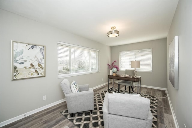 office area featuring baseboards and wood finished floors