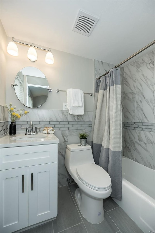 full bath with vanity, visible vents, shower / tub combo, tile walls, and toilet