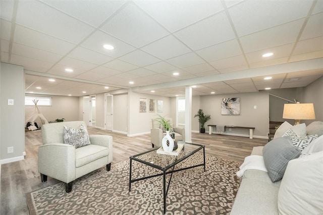 living area featuring wood finished floors and baseboards