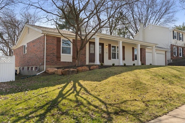 single story home featuring brick siding, fence, a front yard, a chimney, and a garage