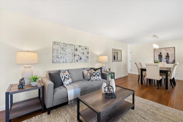 living room with wood finished floors and baseboards