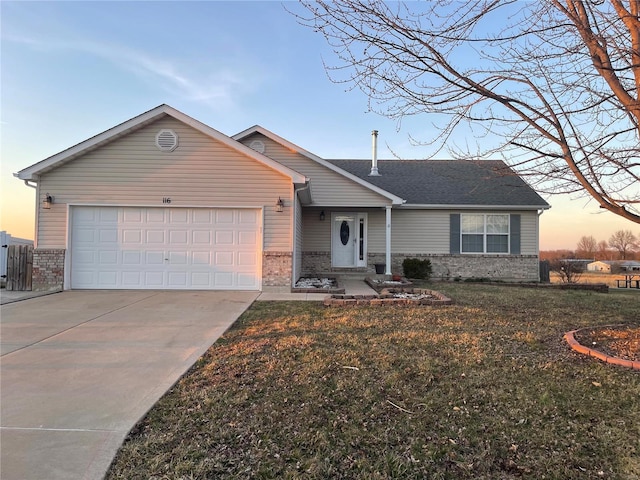 ranch-style home with a front lawn, brick siding, an attached garage, and driveway