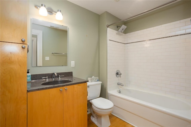 bathroom featuring vanity, toilet, washtub / shower combination, and visible vents