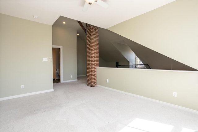 additional living space featuring ceiling fan, baseboards, lofted ceiling, and carpet floors