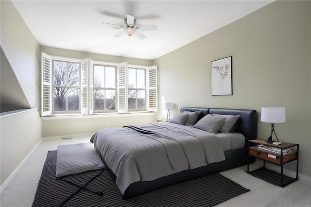 bedroom featuring baseboards, carpet, and a ceiling fan