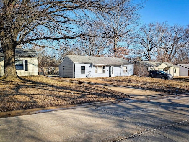 exterior space with concrete driveway