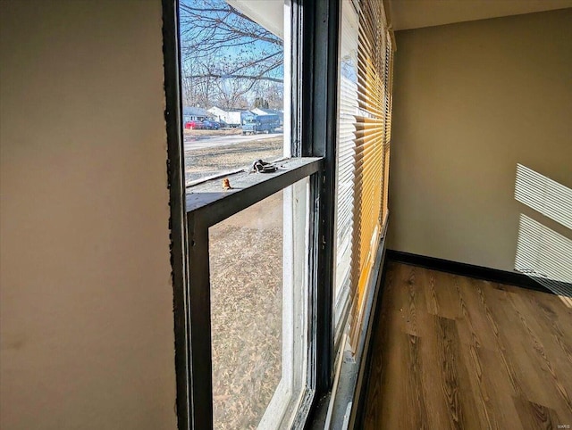 interior details featuring visible vents, baseboards, and wood finished floors