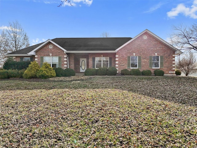 view of front of house featuring brick siding