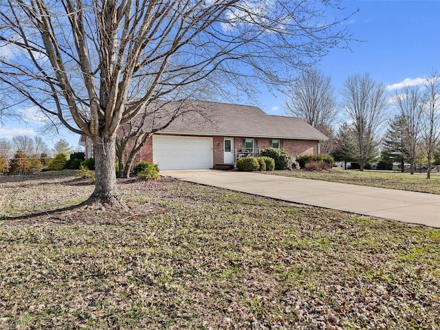 ranch-style house featuring concrete driveway, an attached garage, and brick siding