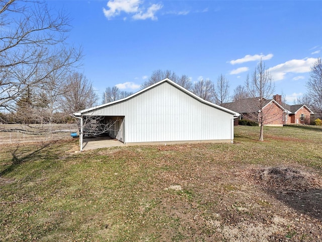 exterior space with an outbuilding and a yard