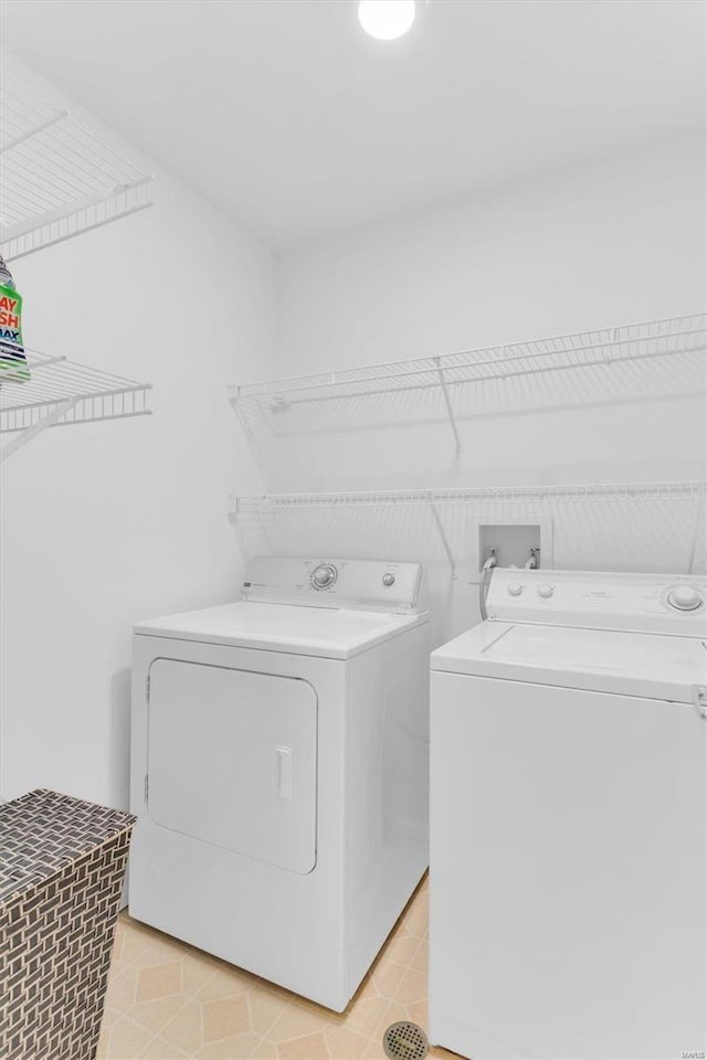 laundry area featuring independent washer and dryer and laundry area