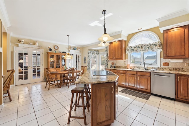 kitchen featuring a sink, stainless steel dishwasher, french doors, light tile patterned floors, and decorative backsplash