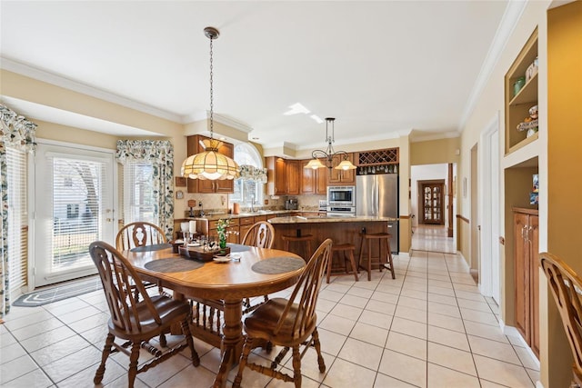 dining area featuring light tile patterned flooring and ornamental molding