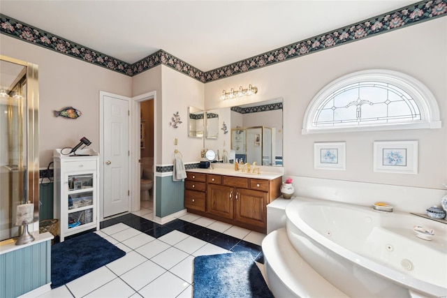 full bath featuring vanity, tile patterned flooring, a shower stall, a jetted tub, and toilet