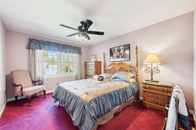 bedroom featuring ceiling fan, baseboards, and dark colored carpet