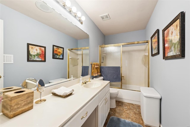 bathroom with enclosed tub / shower combo, visible vents, toilet, and vanity