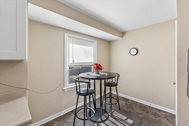 dining space with baseboards