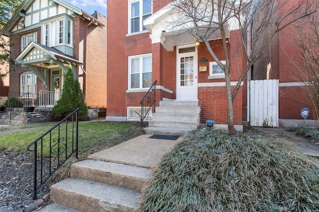 view of front of property featuring brick siding