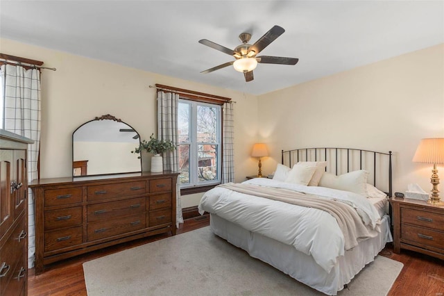 bedroom featuring dark wood-type flooring and a ceiling fan