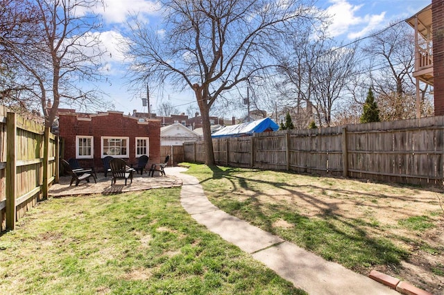 view of yard featuring a fenced backyard and a patio area