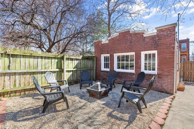 view of patio / terrace featuring a fenced backyard and an outdoor fire pit