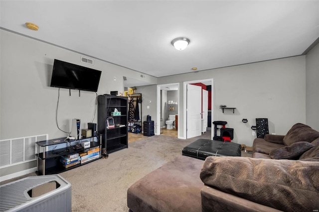 living room featuring visible vents and carpet floors