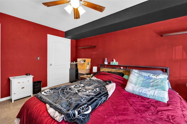 bedroom featuring baseboards, carpet floors, and ceiling fan