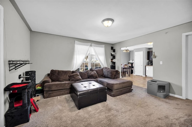 living room featuring baseboards and carpet floors