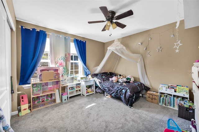 carpeted bedroom featuring a closet and ceiling fan