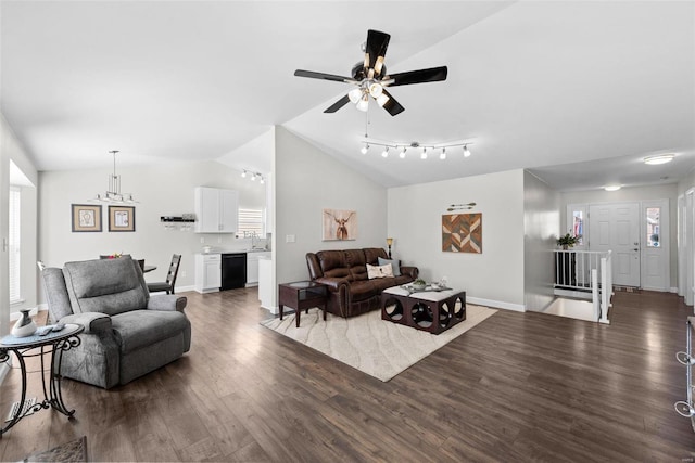 living room with a wealth of natural light, ceiling fan, lofted ceiling, and wood finished floors