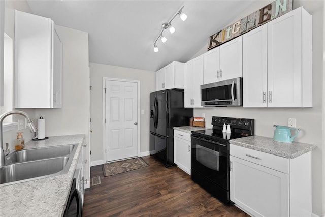 kitchen with black appliances, a sink, dark wood finished floors, white cabinets, and light countertops