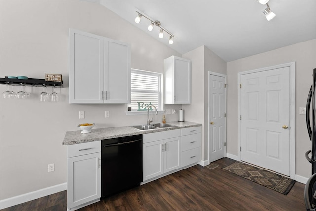 kitchen with white cabinetry, lofted ceiling, a sink, light countertops, and dishwasher