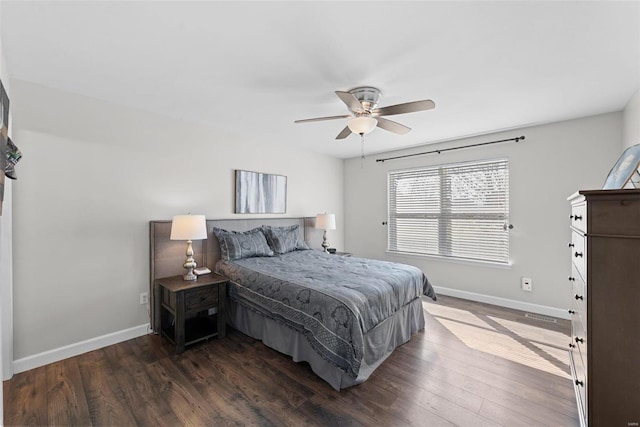 bedroom with dark wood-type flooring, baseboards, and ceiling fan