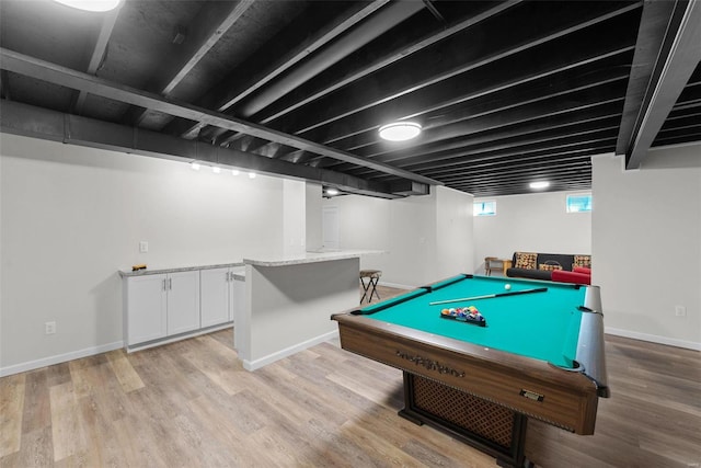 recreation room featuring light wood-type flooring and baseboards