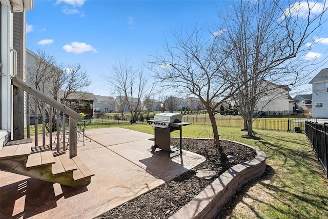 view of yard with a fenced backyard, a residential view, and a patio