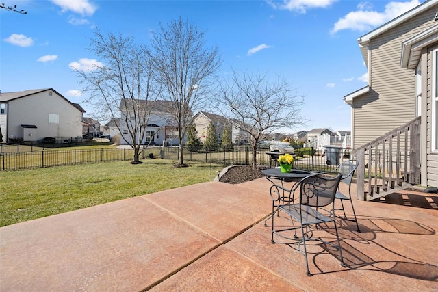 view of patio / terrace with a residential view and fence