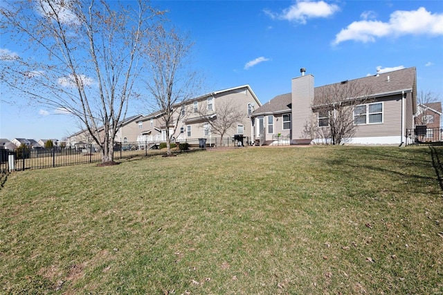 exterior space featuring fence and a residential view