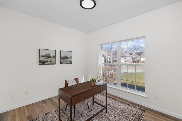 office with a wealth of natural light, baseboards, and wood finished floors