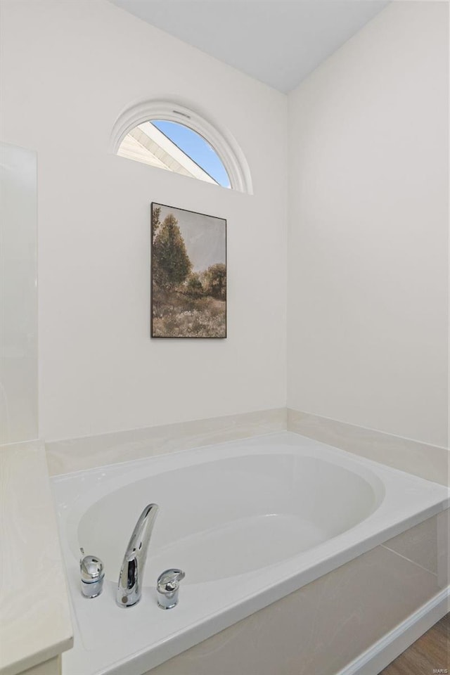 bathroom featuring a garden tub