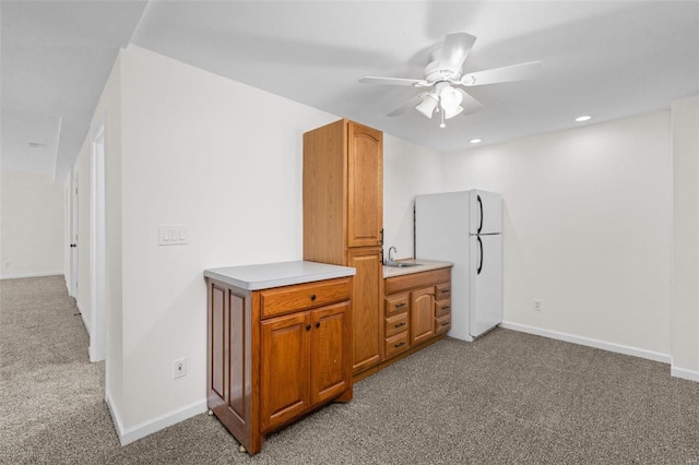 interior space with recessed lighting, baseboards, and light carpet