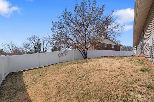 view of yard with a fenced backyard