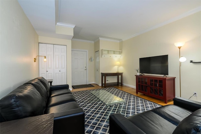 living room with crown molding, wood finished floors, and baseboards