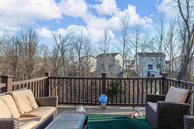 wooden deck with an outdoor hangout area