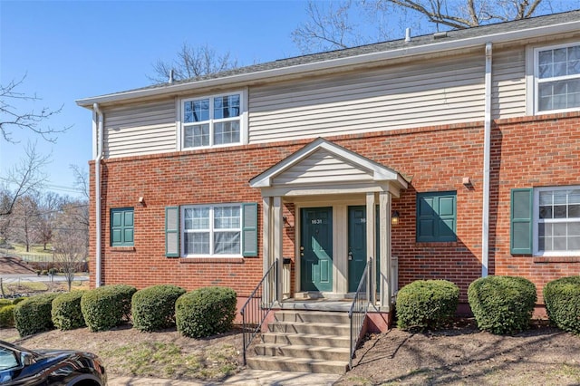 view of front of home featuring brick siding