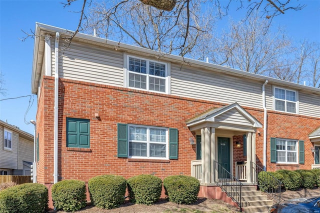 view of front of property featuring brick siding