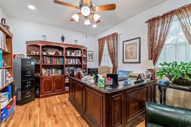 office space featuring light wood finished floors, recessed lighting, and ceiling fan