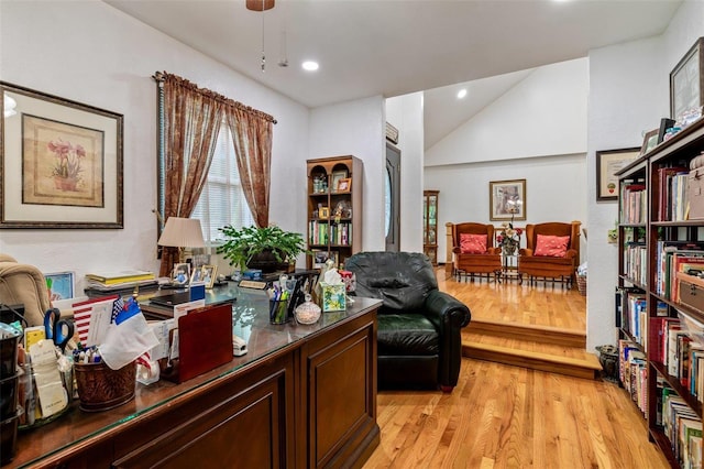 home office with recessed lighting, lofted ceiling, and light wood-style floors